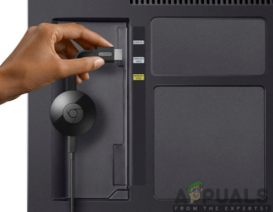 Plugging Google Chromecast into the TV