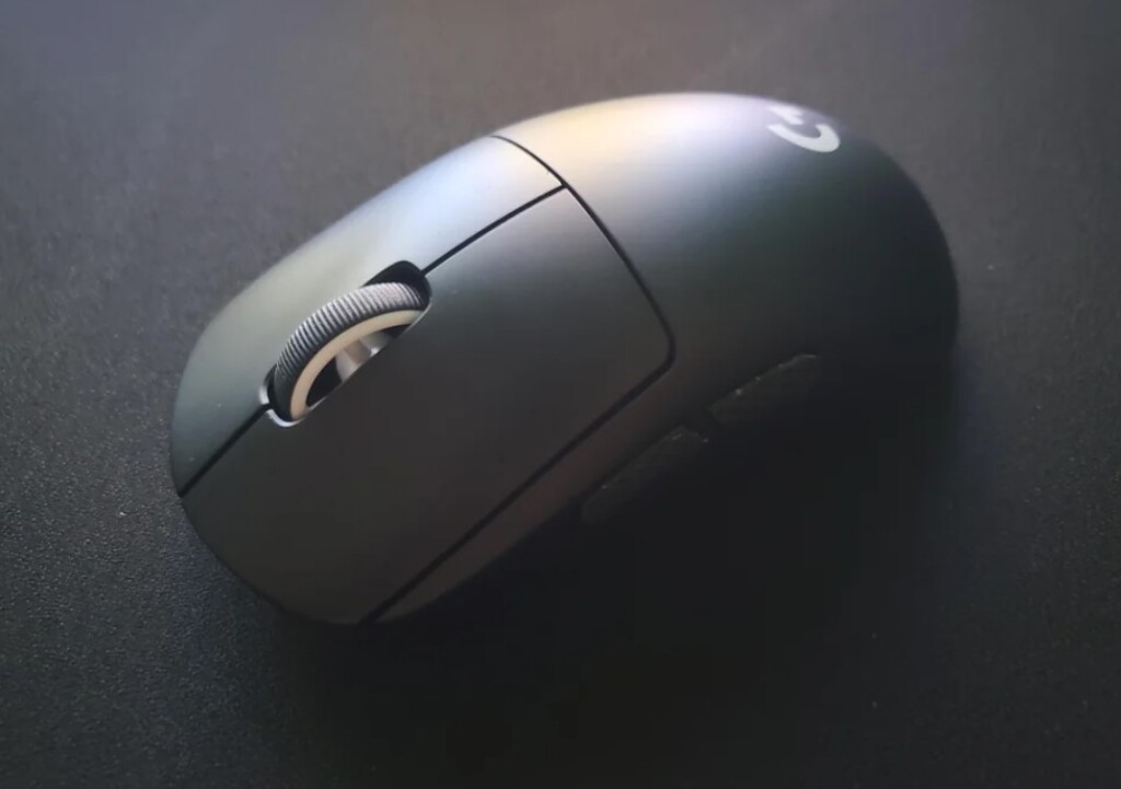 Logitech G Pro X Superlight gaming mouse front view along with a mousepad