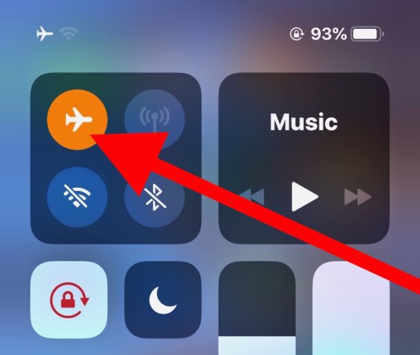 iPhone control center showing Airplane Mode enabled with red arrow pointing to the icon