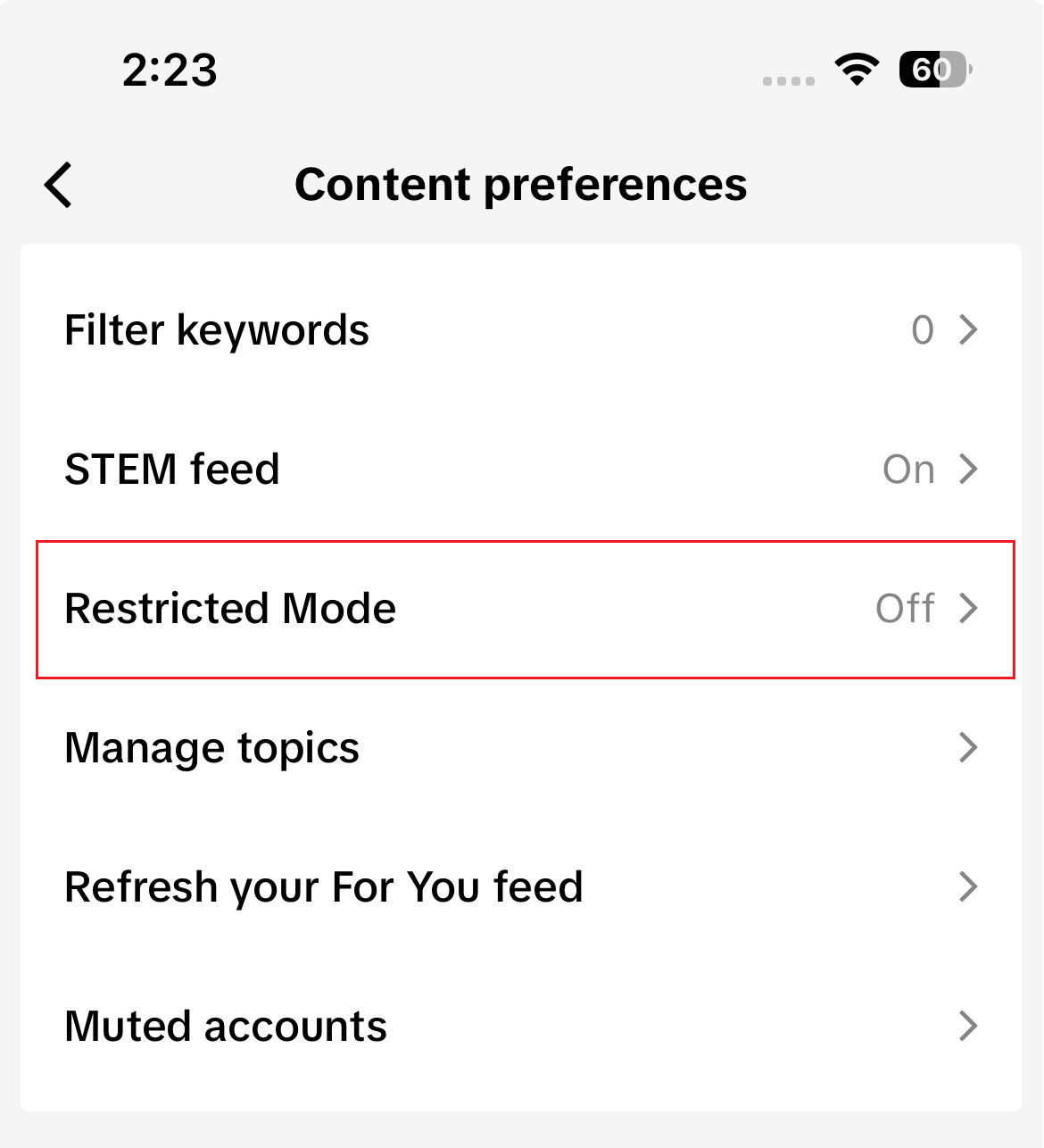 TikTok Content preferences screen showing Restricted Mode turned off.