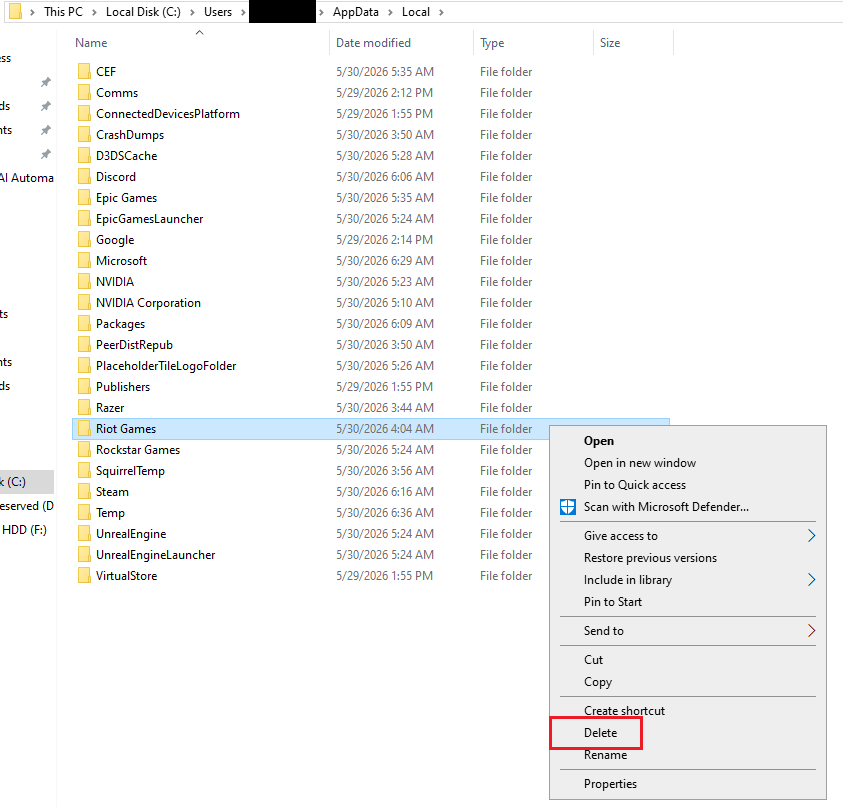 Windows File Explorer deleting leftover Riot Games folders from C drive and Local AppData before a clean reinstall.