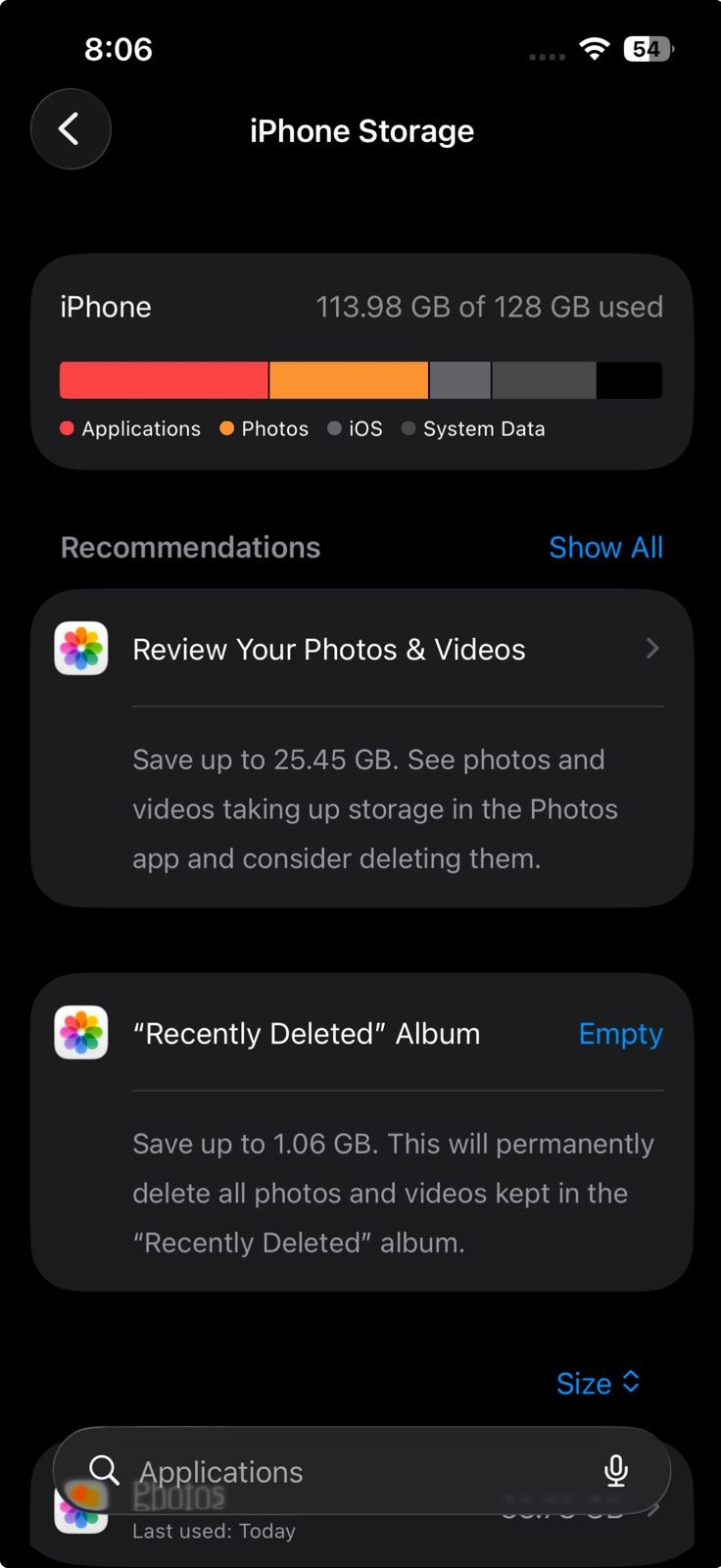 iPhone Storage settings while freeing space for Apple Intelligence model downloads.