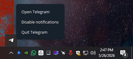 Windows system tray showing Telegram still running in hidden icons instead of opening a normal window.